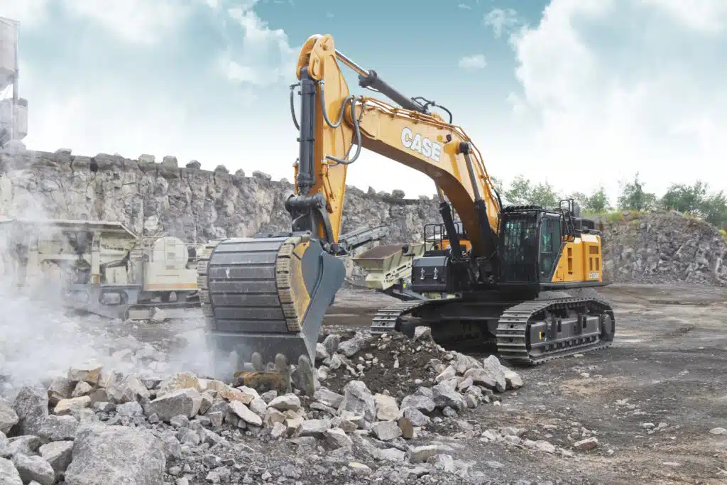 How Much Does an Excavator Cost? (From $900/Day) 2 A full size excavator moving rocks.