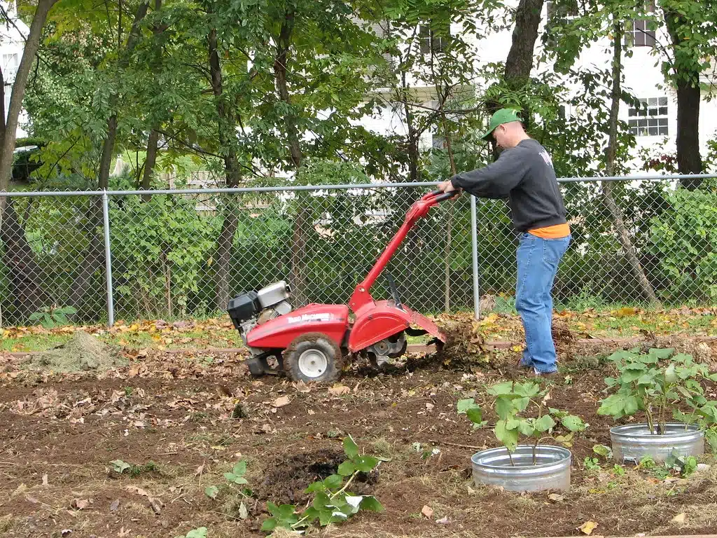 Man with red rototiler