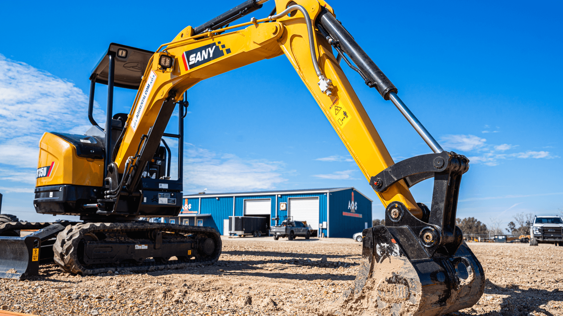 Sany SY35U," "mini excavator," "yellow excavator," "construction equipment," "AOS building," "excavator bucket," "digging.